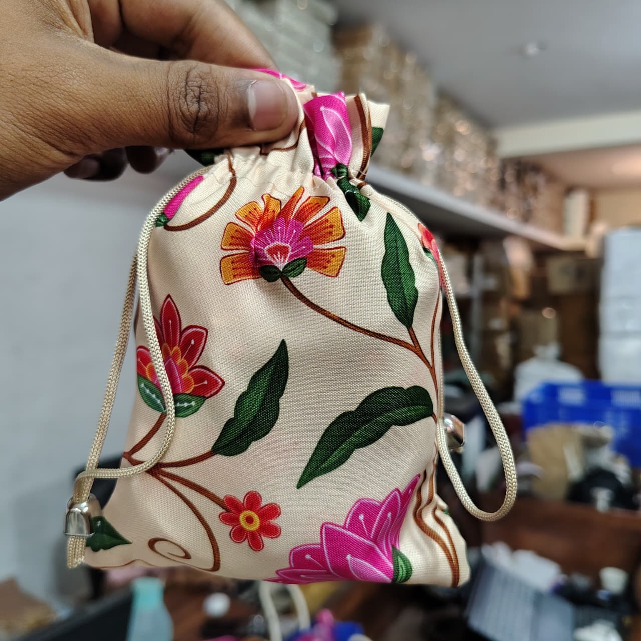 Floral Fabric Potli Bag with Bell | Multiple Designs Drawstring Gift Pouch | Pack of 10 - Image 17